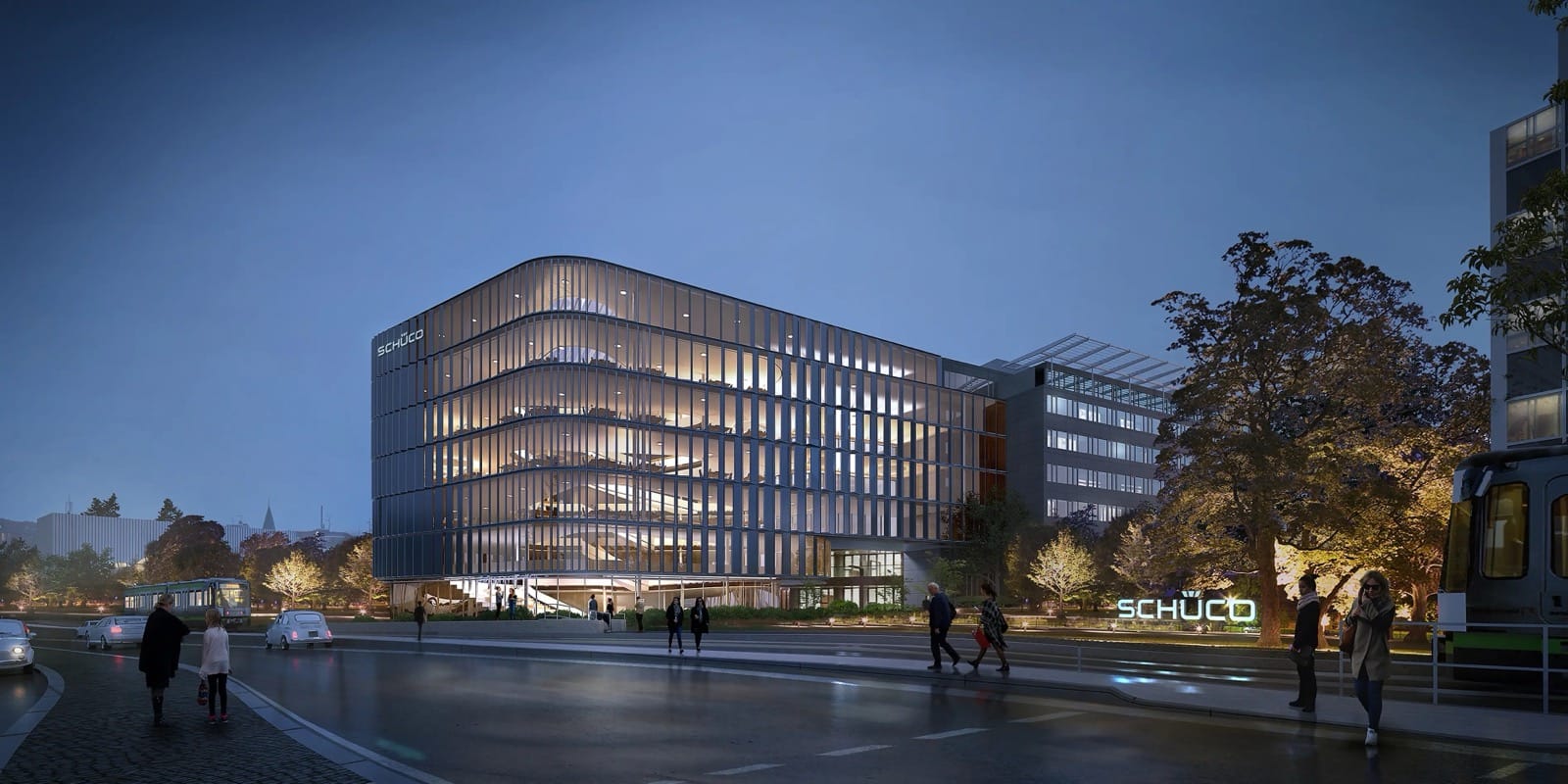 Schüco Hauptsitz Bielefeld mit Neubau Schüco One, Abendaufnahme mit Passanten
