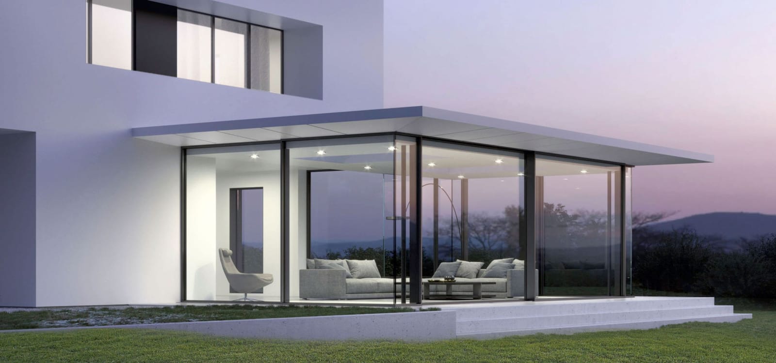 Solarlux SDL Avalis Wintergarten mit Flachdach an modernem Einfamilienhaus in der Abenddämmerung