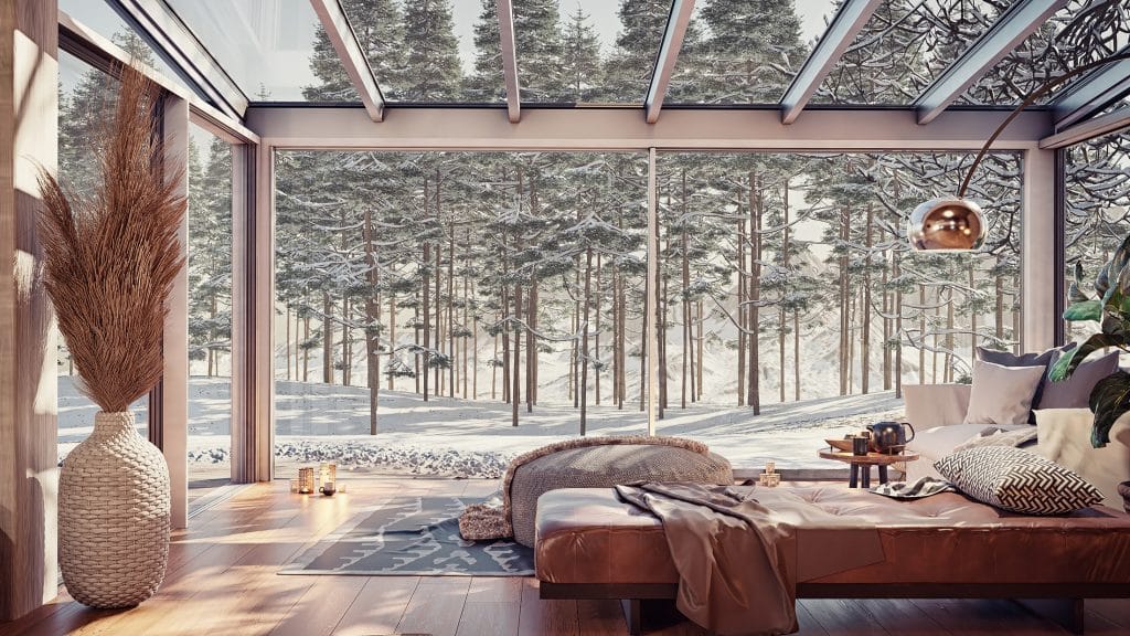 Innenansicht eines Wipro Diafano Plus Wintergartens im Winter mit Blick auf verschneiten Wald